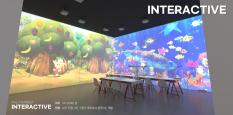 Children can sit at their desks and experience interactive media art.